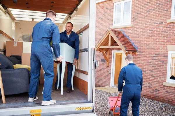 depositphotos_299151070-stock-photo-removal-company-workers-unloading-furniture